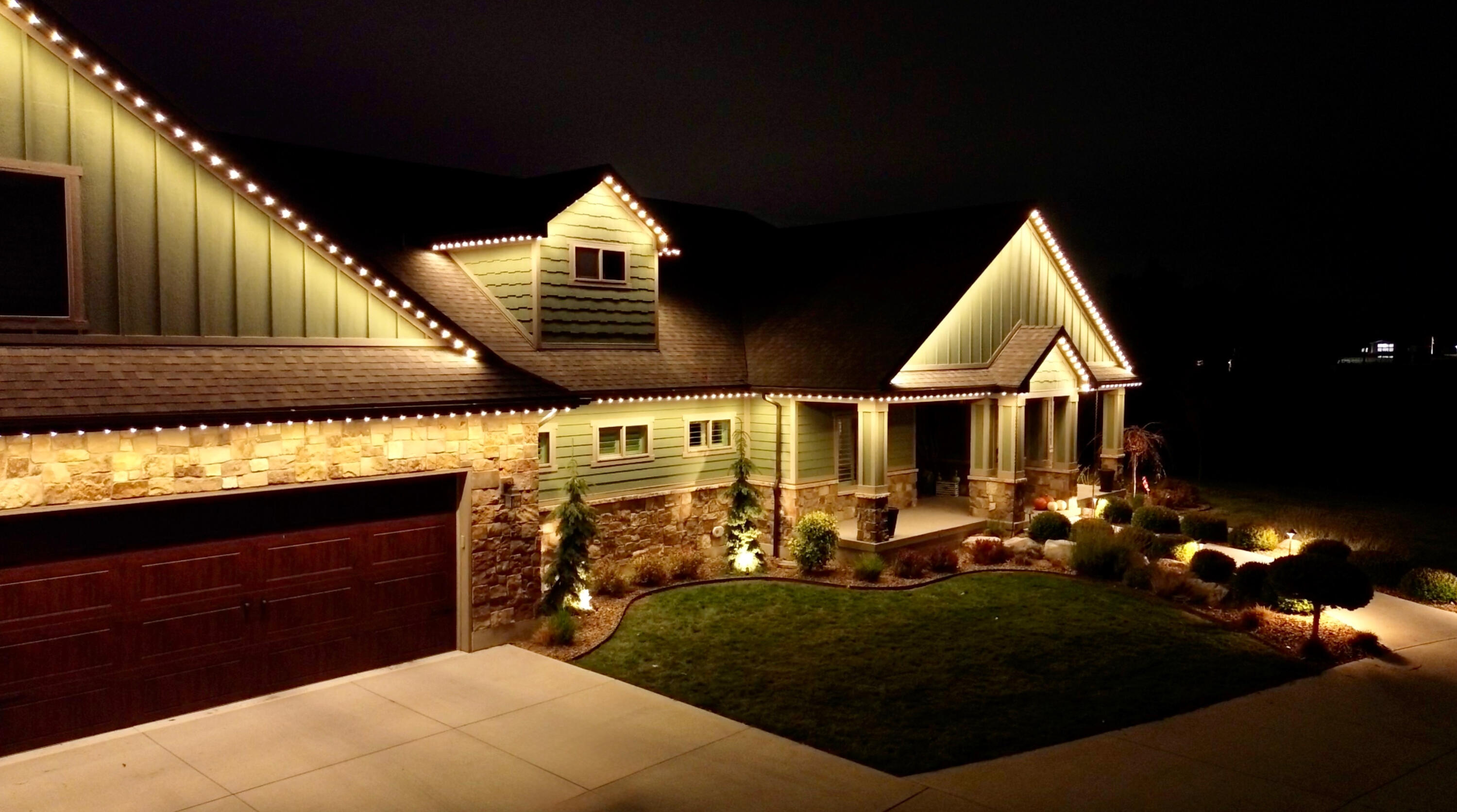 Backyard Patio Lighting for Summer Nights Covered backyard patio with warm permanent lighting creating a relaxing evening atmosphere